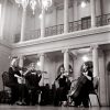 The Pizzicatos perform in a grand hall for a wedding